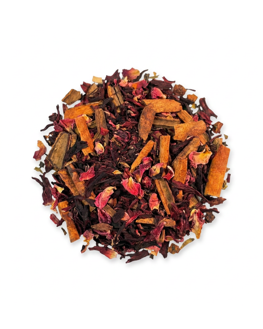 dried hibiscus, cinnamon, and rose petals tea blend on a white background